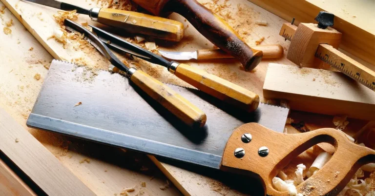 woodworking hand tools and shavings on a workbench used to build a swivel base