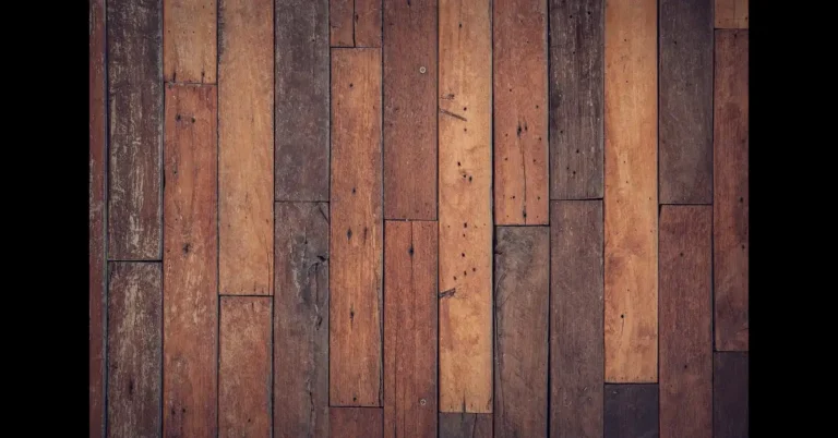 Worn hardwood floor planks showing scratches and dull finish before refinishing
