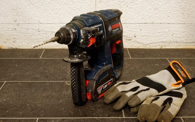 Lithium battery pack in a cordless impact drill Close-up of a rechargeable lithium battery pack seated in a cordless impact drill