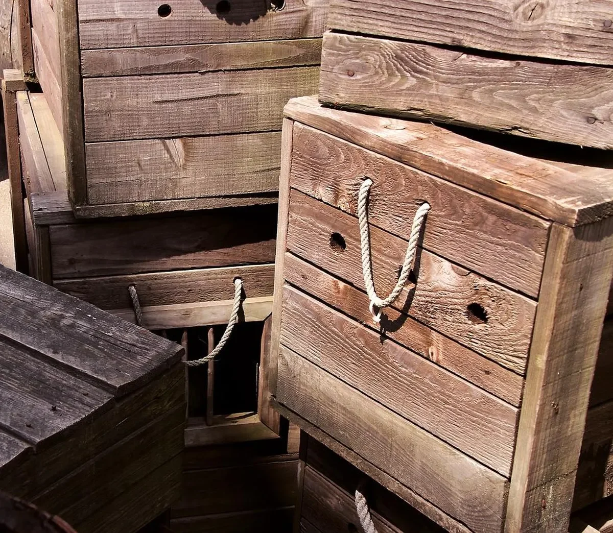 Stacked wooden crates with rope handles