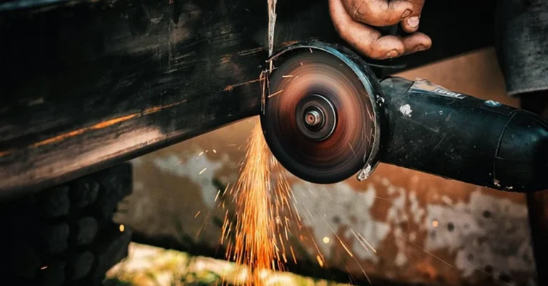 Cutting metal with a power tool sends off bright sparks and metal chips