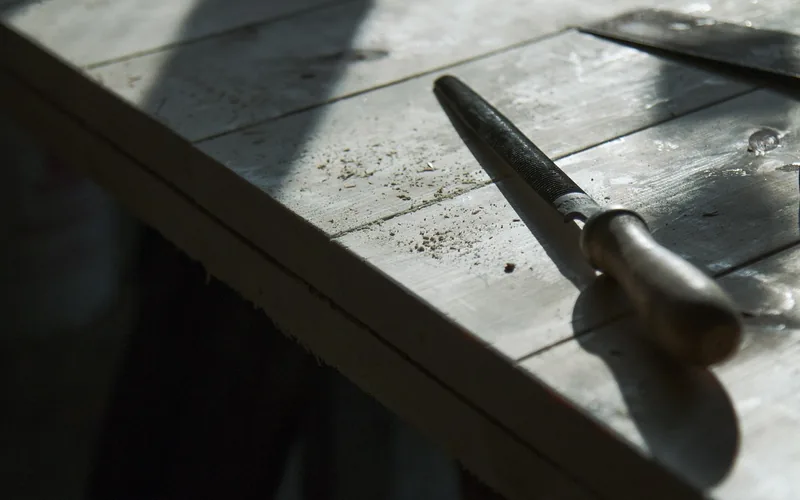 carpenter working with wood boards and tools in a woodworking workshop carpenter working with wood boards and tools in a woodworking workshop