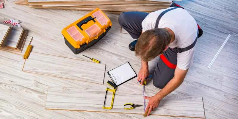 DIY flooring installation measuring and cutting planks