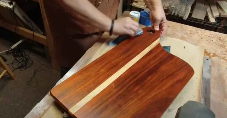 Applying Polycrylic finish to a wood cutting board with a foam applicator