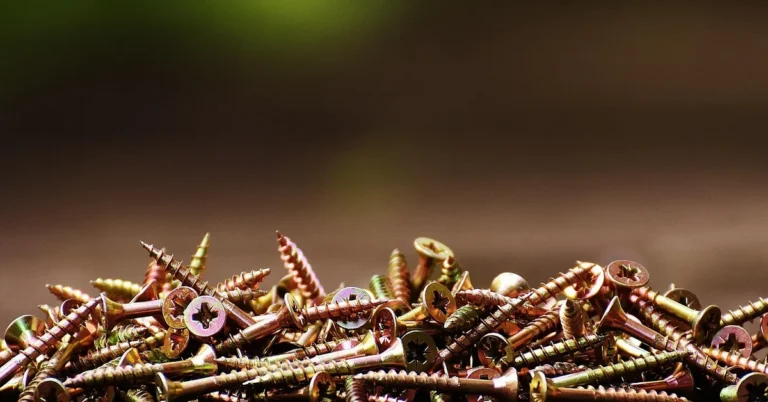 Close-up of zinc-plated fine thread wood screws showing shallow thread pitch used for hardwood