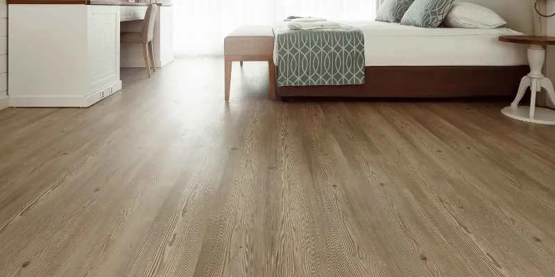 Finished hardwood floor in a bedroom with natural wood grain visible
