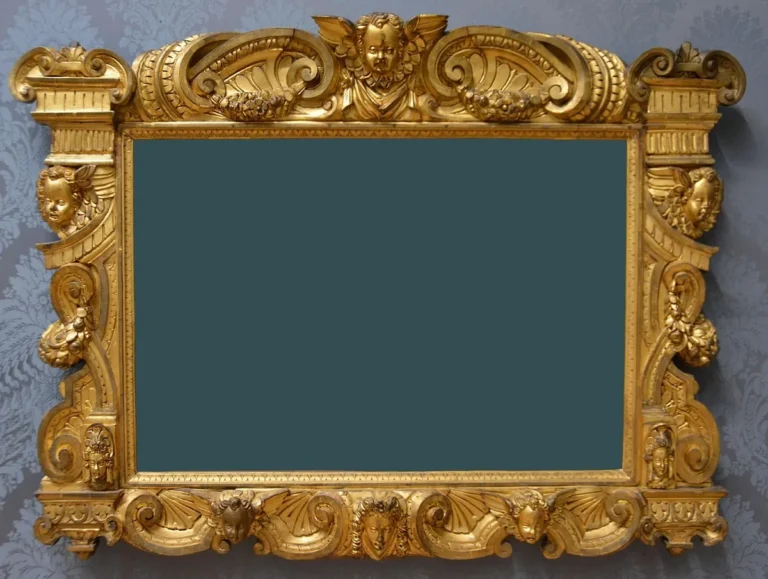 Ornate carved and gilded wooden picture frame