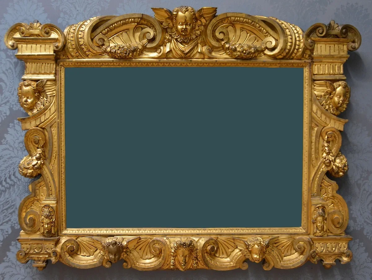 Ornate carved and gilded wooden picture frame