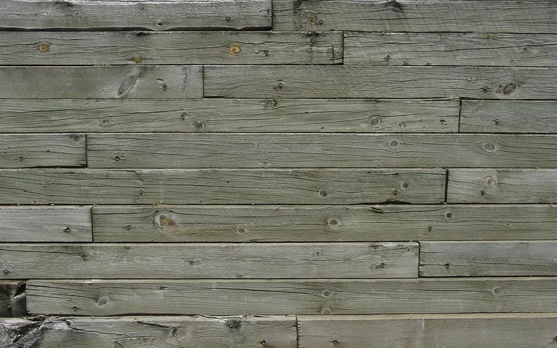 Gray weathered wood planks on an outdoor structure Gray weathered wood planks on an outdoor structure