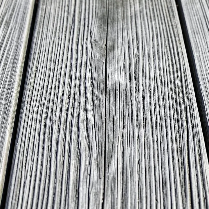 gray weathered cedar wood boards with raised wood grain texture