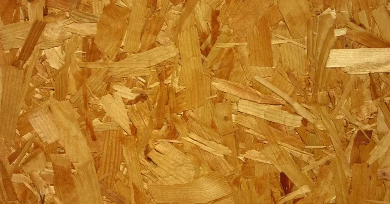 Close-up of OSB oriented strand board showing its layered wood-strand texture