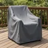 Weather-resistant cover draped over outdoor patio furniture