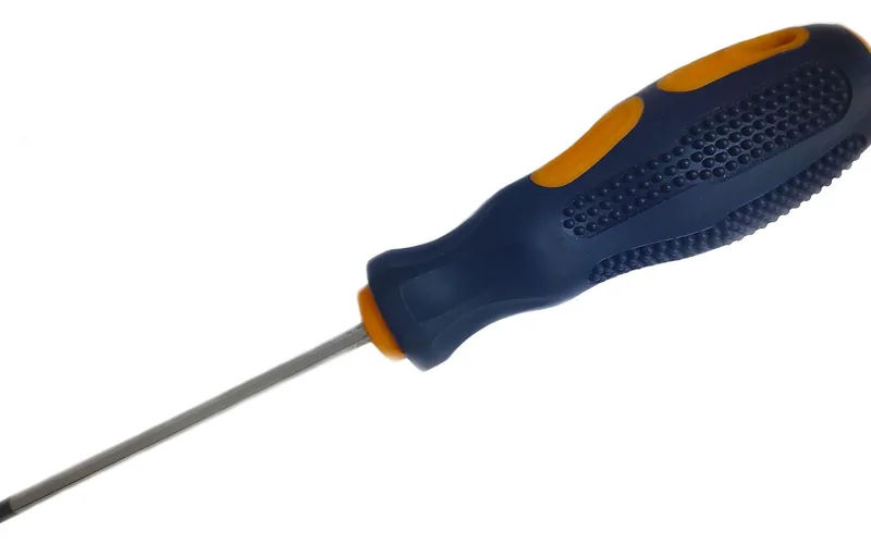 Phillips head screwdriver used to unscrew wooden drawer pulls from the drawer front Phillips head screwdriver used to unscrew wooden drawer pulls from the drawer front