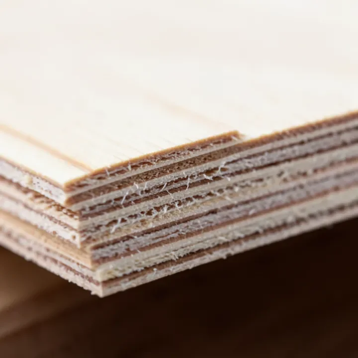 Close-up of plywood edge showing alternating veneer layers
