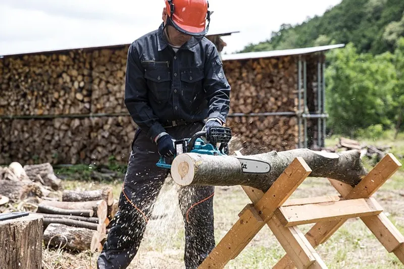 Poulan chainsaw cutting through a wood log outdoors
