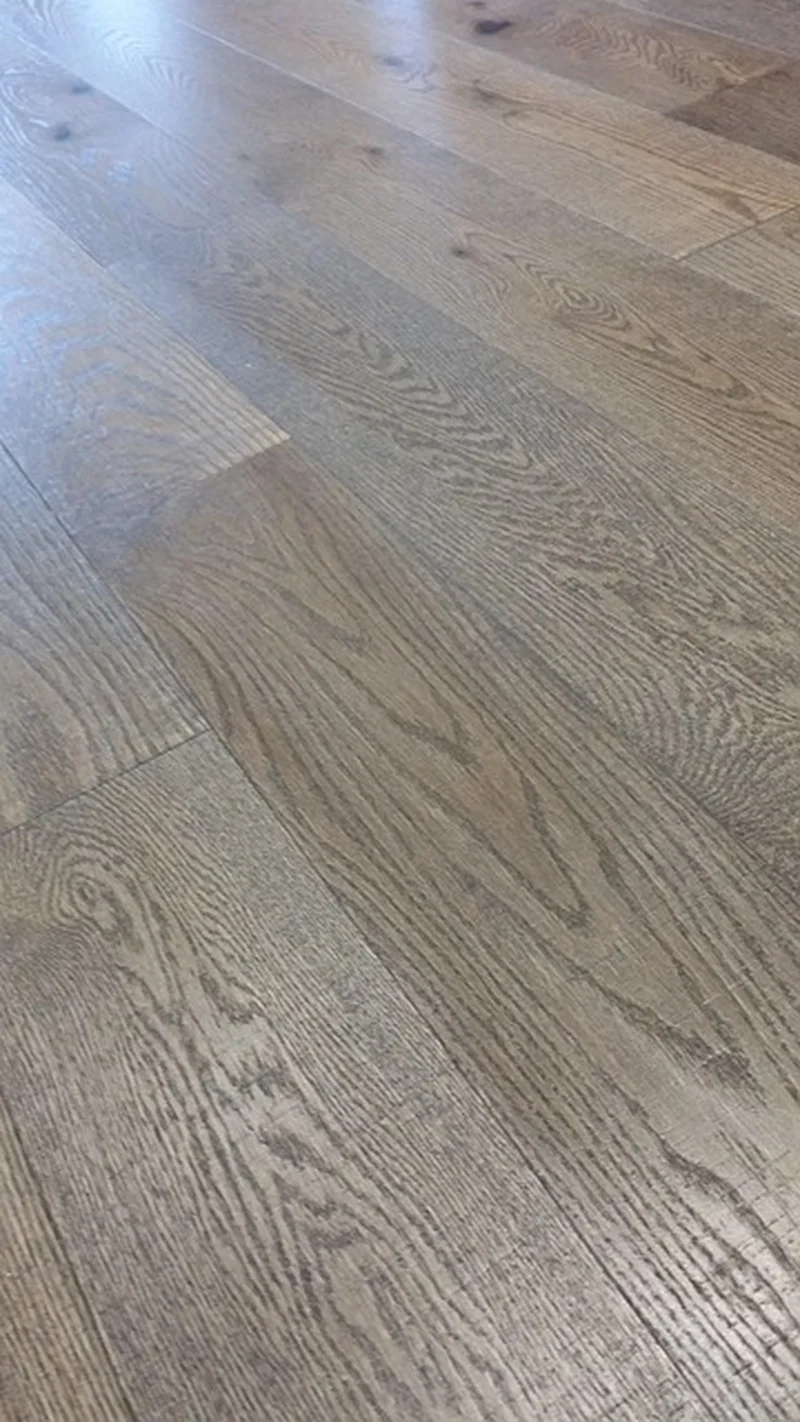 Close-up of wide-plank prefinished white oak flooring showing wood grain