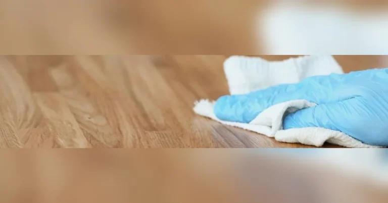 Damp cloth and hot iron used to remove a dent from a hardwood floor