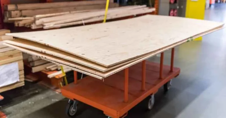 Stack of RTD plywood sheets on a cart at a building supply store