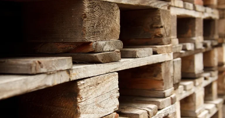 close-up of stacked wooden pallets showing wear and board condition