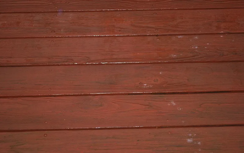 Wet deck boards glistening with a slick film of water after rain Wet deck boards glistening with a slick film of water after rain