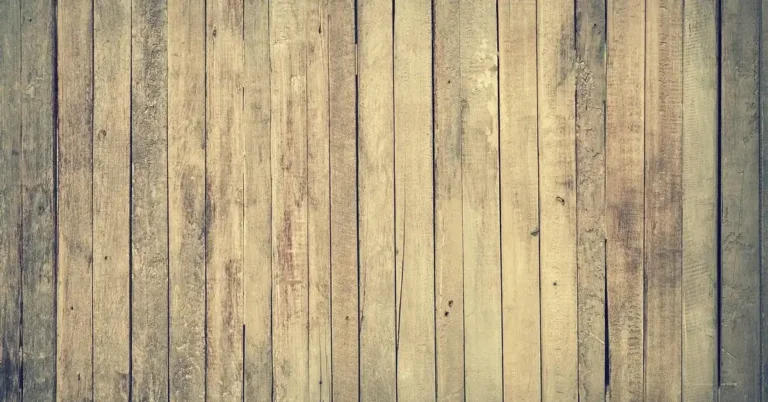 Weathered wooden fence planks showing the natural brown tones of aged wood grain