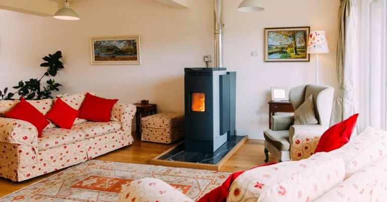 Freestanding wood burning stove heating a home living room, similar to an add-on furnace setup