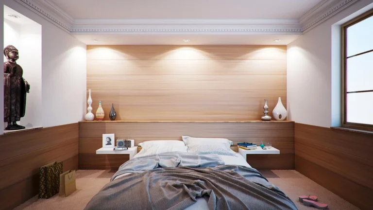 Wooden bed in a bedroom with a paneled wall