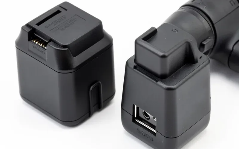 Battery adapter connecting a cordless drill to a different brand's battery pack Battery adapter connecting a cordless drill to a different brand's battery pack