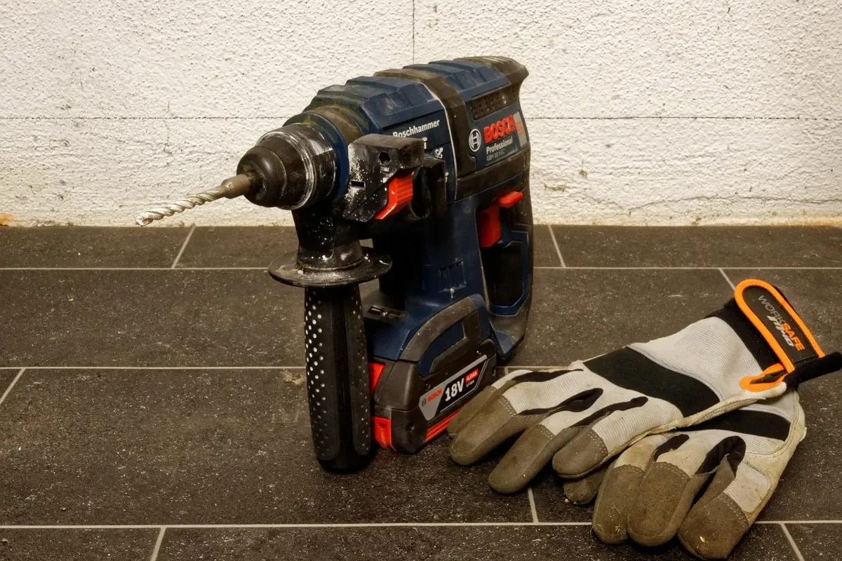 Blue Bosch Professional cordless rotary hammer with an 18V battery pack