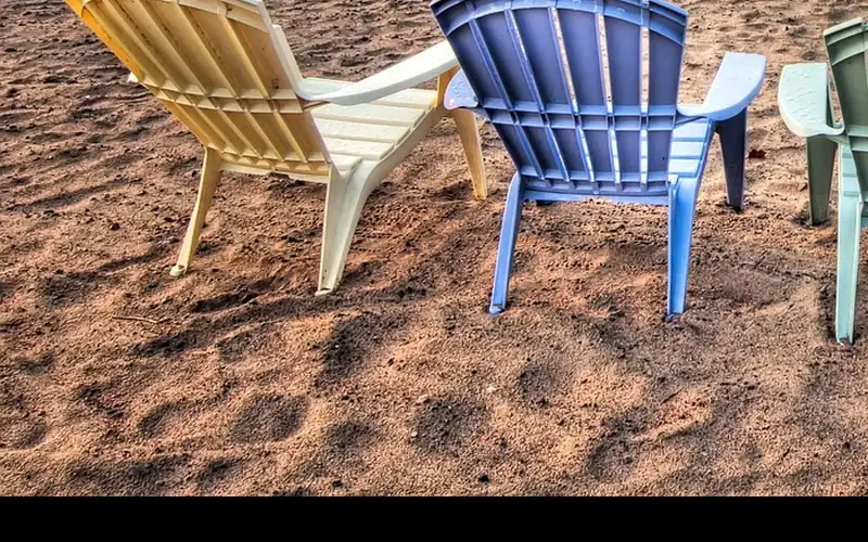 close-up of colorful recycled HDPE plastic outdoor chair slats in blue and green