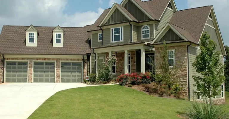 Two-story wood-framed house with vinyl siding and stone accents