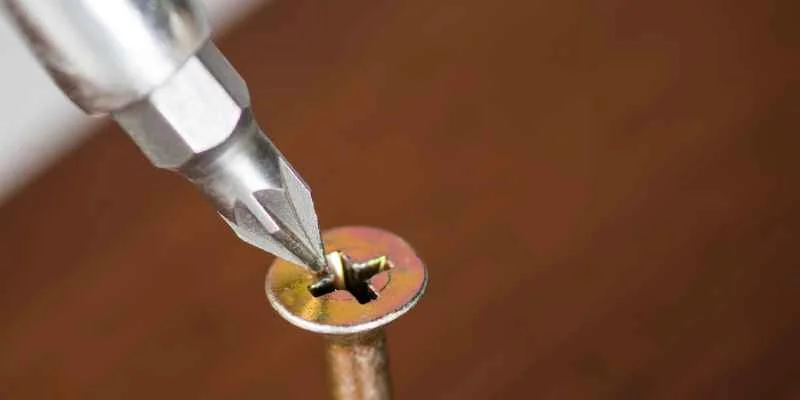 Drill bit used as a screwdriver alternative on a screw