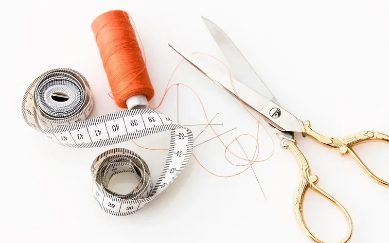 Fabric scissors and a tape measure laid out for cutting lining panels Fabric scissors and a tape measure laid out for cutting lining panels