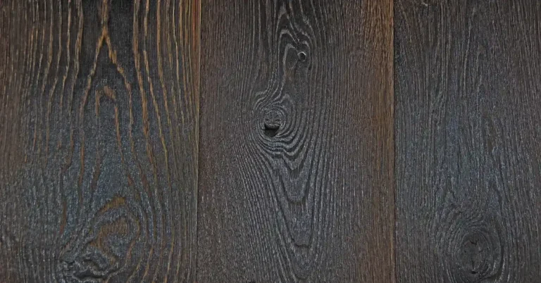 Near-black oak boards with the grain still visible through the dark finish