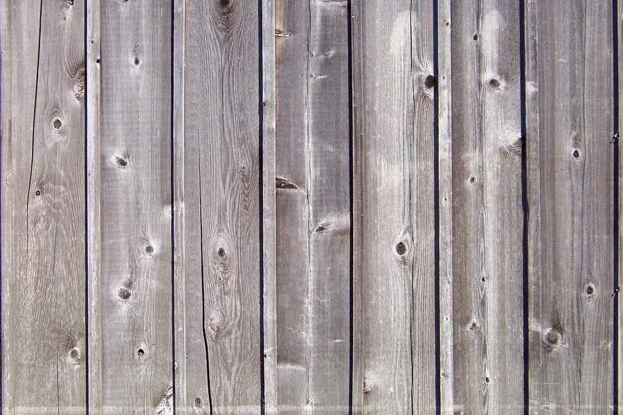 Gray weathered wood planks showing outdoor patina and knots