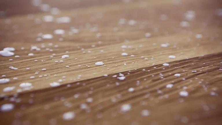 PVA wood glue drops on wood grain surface