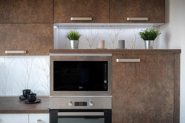 Kitchen cabinets finished in a wood-grain melamine laminate over a composite wood core