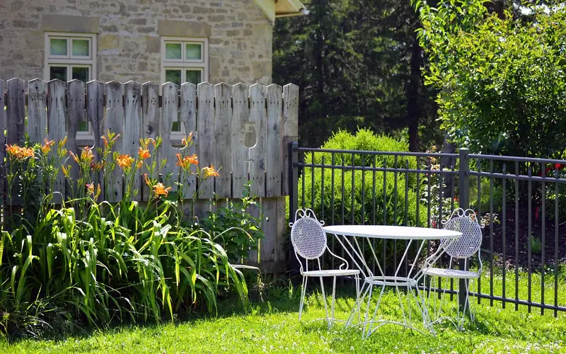 outdoor patio table and chairs positioned away from overhanging trees