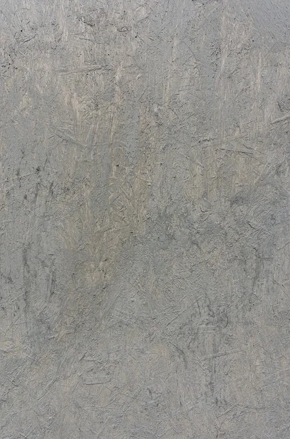 Close-up of the raw particleboard core exposed at an unsealed melamine panel edge
