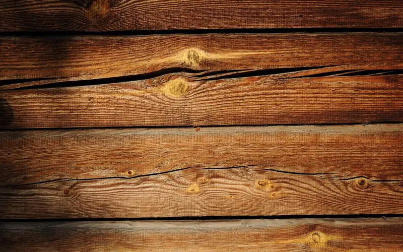 close-up of raw pine boards showing grain, knots, and resin pockets close-up of raw pine boards showing grain, knots, and resin pockets