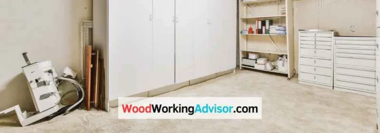 White plywood shop cabinets installed along a garage wall for tool storage