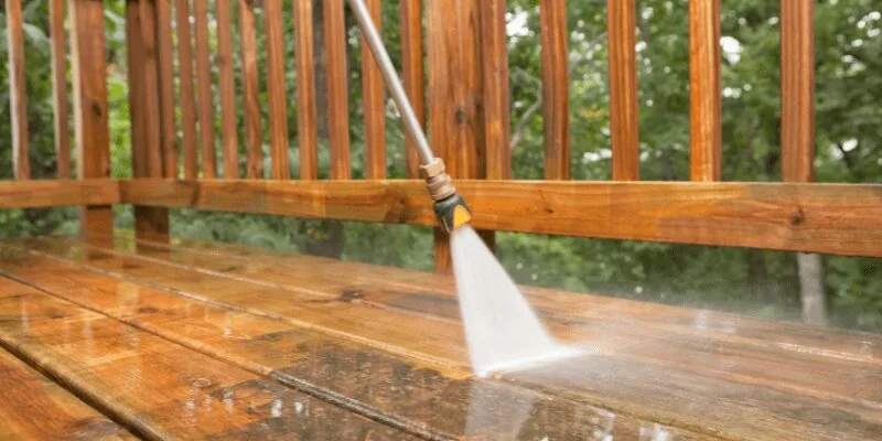 A clean pressure-treated wood deck after scrubbing with soap and water