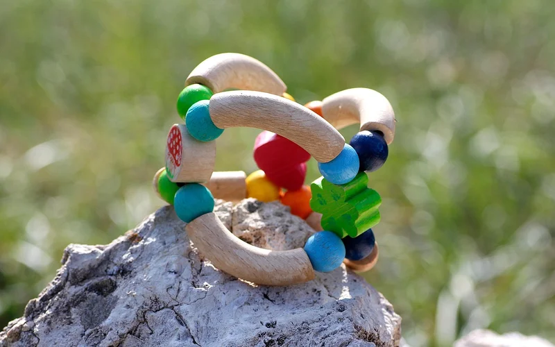 Wooden baby teething ring finished with a food-safe oil and beeswax blend