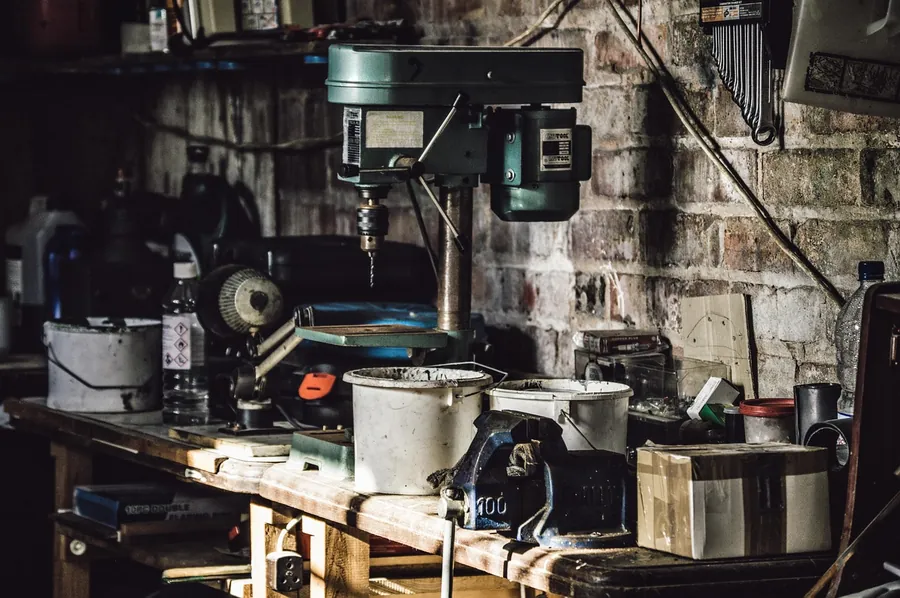 Drill press in a home workshop, representing Ryobi power tool category