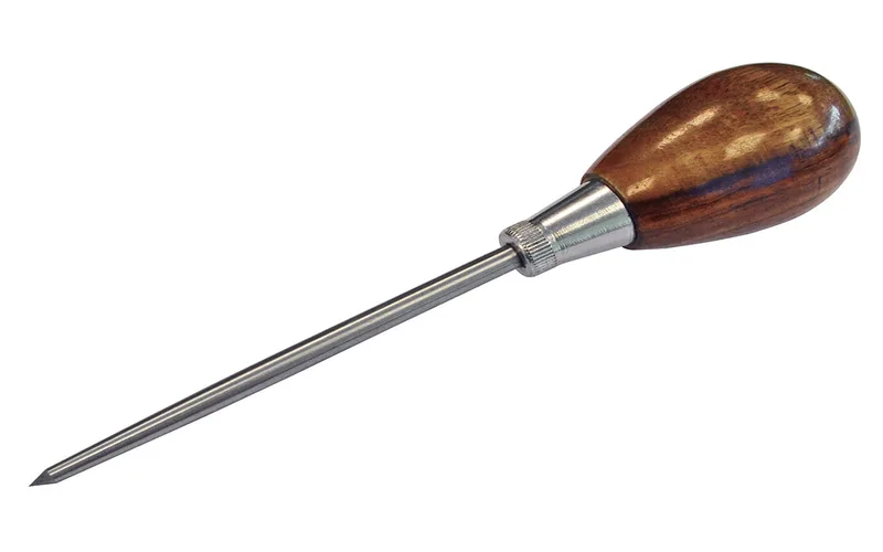 Scratch awl being used to start a pilot hole before driving a screw