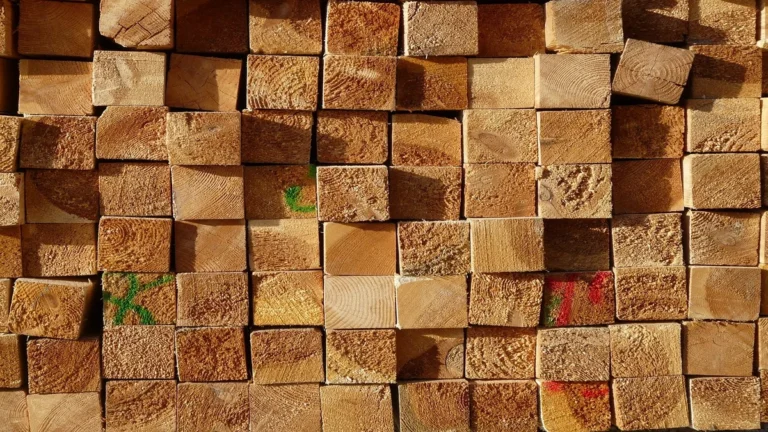 Stacked sawn lumber board ends marked for grade sorting