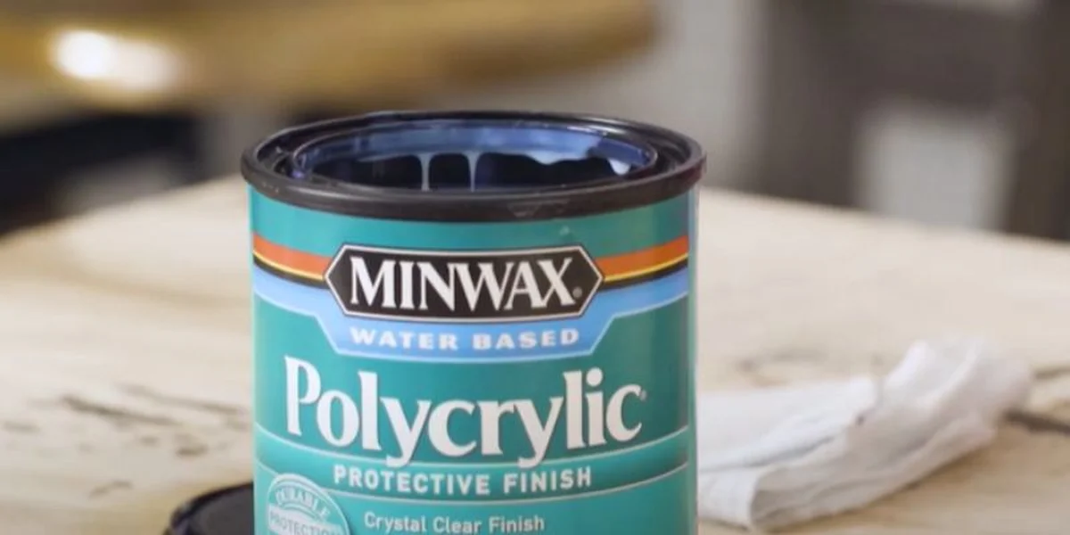 Can of Minwax Polycrylic water-based protective finish on a workbench, ready to spray