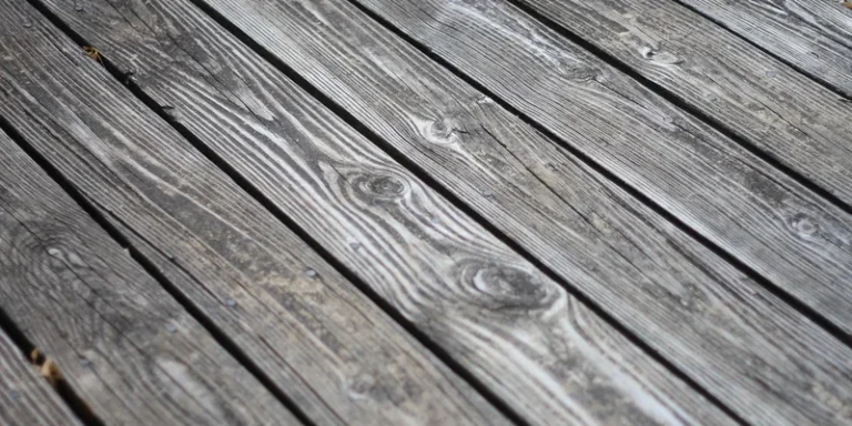 Weathered wood deck planks showing natural grain before cleaning