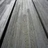 Wood grain darkened by a curing wood finish oil