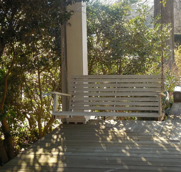Wood porch column supporting a covered porch roof